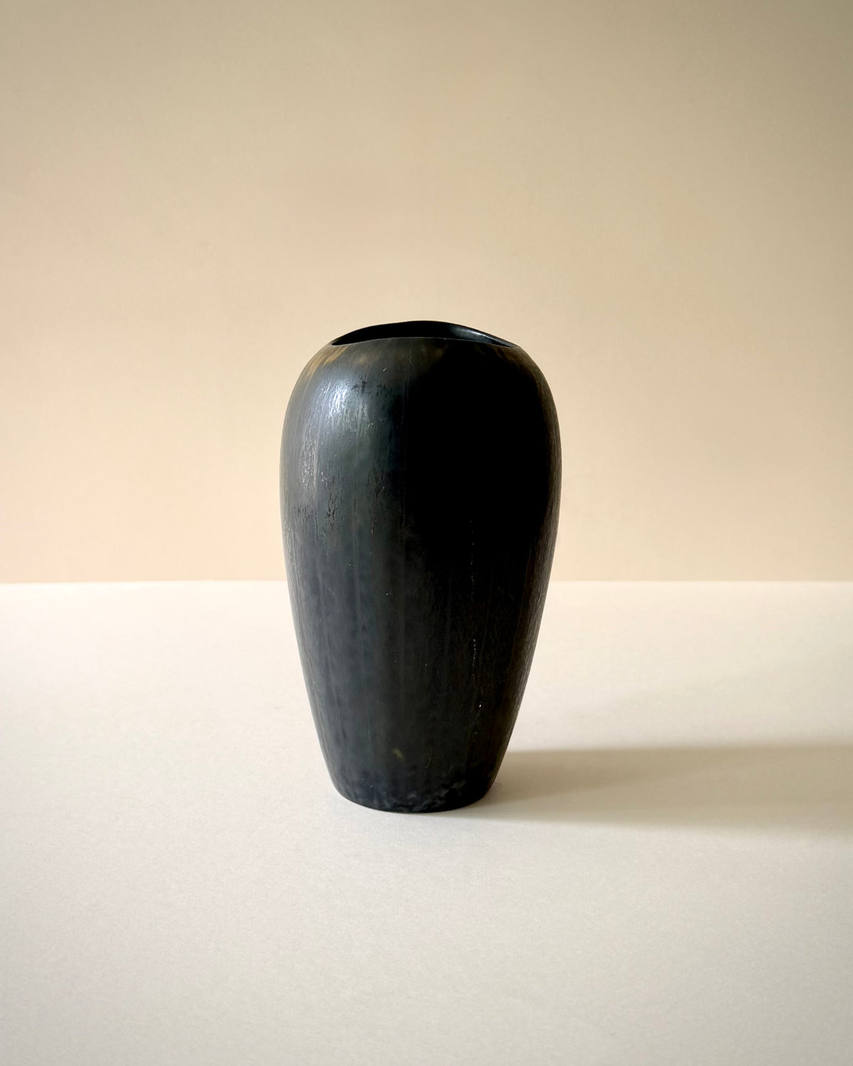 Rörstrand AXZ vase viewed from a slight angle, showing its asymmetric rim.