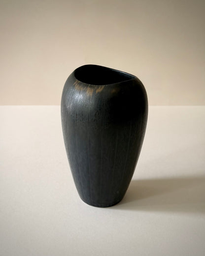 Angled view of the Rörstrand AXZ vase highlighting the rim and textured glaze.