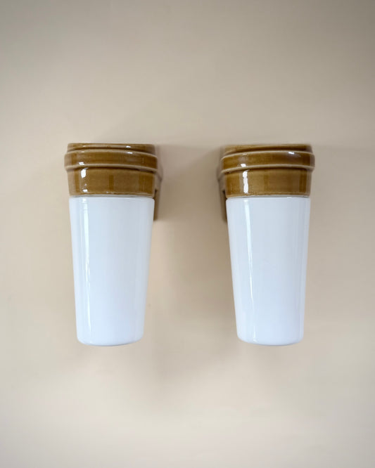 Pair of Ifö Model 6080 wall lamps shown with the opal glass shades facing downwards.