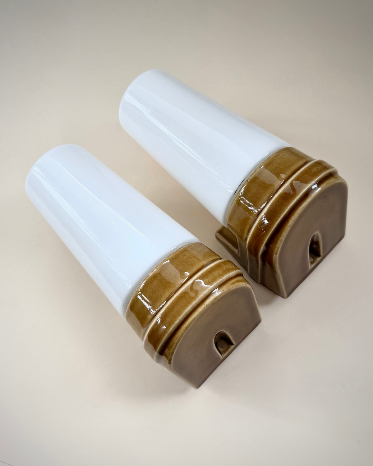 Reverse view of the two Ifö Model 6080 wall lamps showing the ceramic mounting bases.