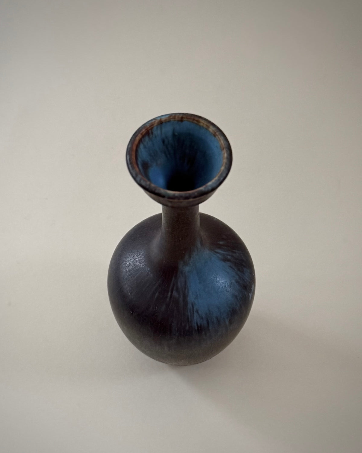 Rörstrand ASI vase showing its rounded body, slender neck and dark Hares Fur glaze.