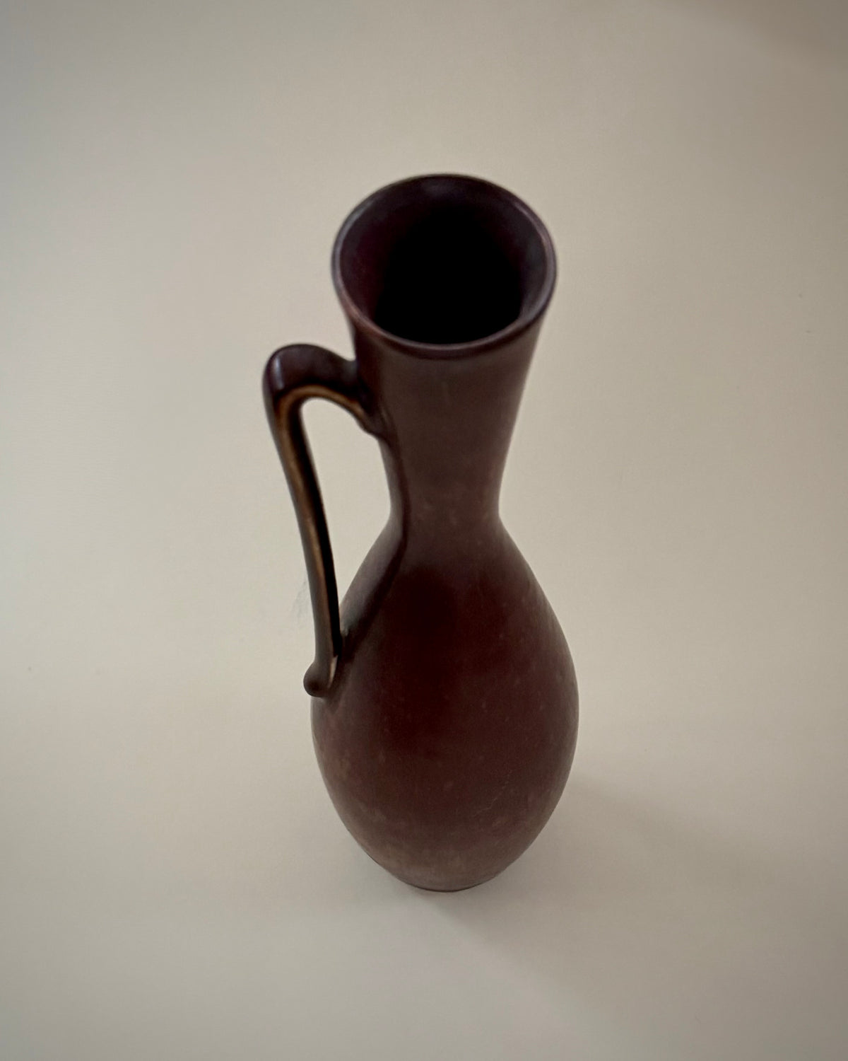 Alternate view of the Rörstrand NSZ handled vase, showing the elongated silhouette and glazed interior.
