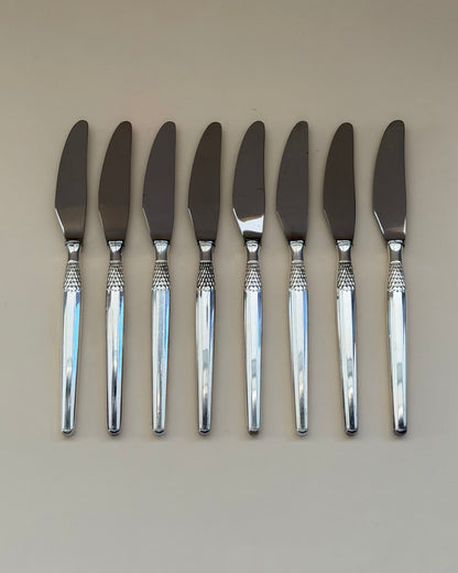 Eight GAB Cheri silver-plated table spoons arranged side by side.