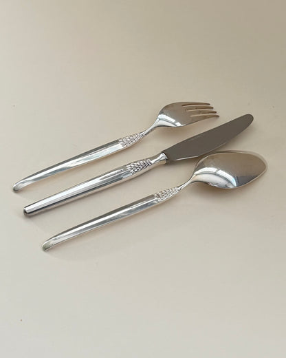 GAB Cheri table fork, knife and spoon shown together at an angle.