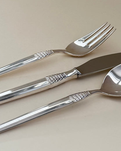 Eight GAB Cheri silver-plated table forks arranged in a row.