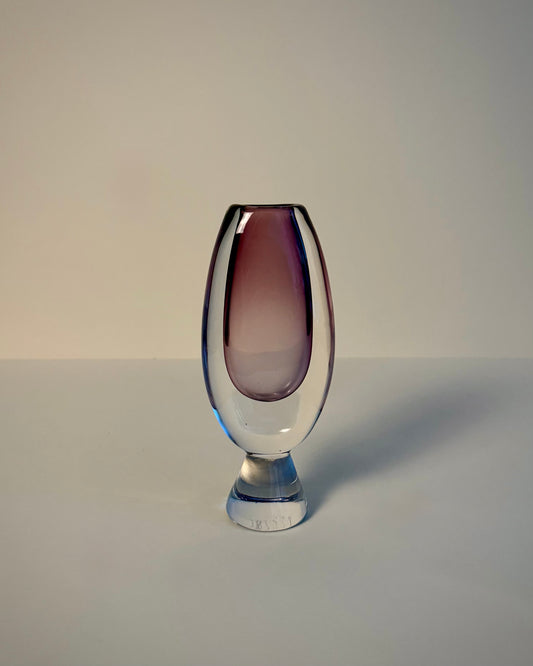 Kosta LH 1657/128 Sommerso glass vase by Vicke Lindstrand lying on its side, showing the rim opening and amethyst-purple body