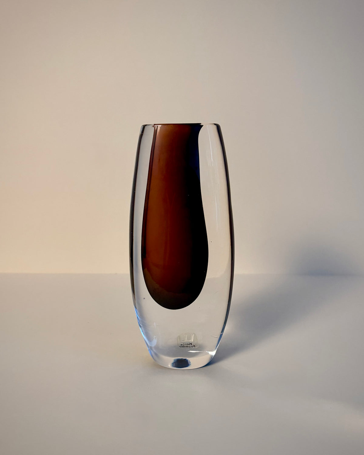 Kosta LH 1444 Sommerso vase by Vicke Lindstrand, straight-on view showing the reddish-brown core cased in clear glass